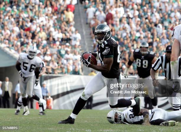 Wide receiver Terrell Owens of the Philadelphia Eagles runs the ball against the Oakland Raiders on September 25, 2005 at Lincoln Financial Field in...