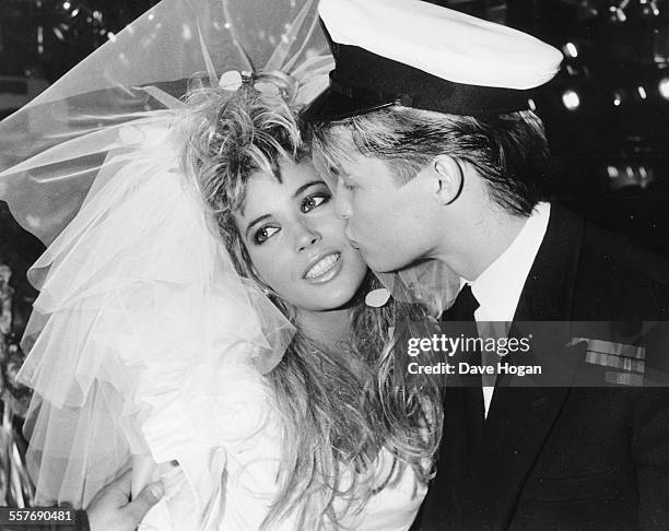 Models Mandy Smith and David Cuerden dressed as bride and groom, for a fashion show at Stringfellows night club, London, October 2nd 1986.