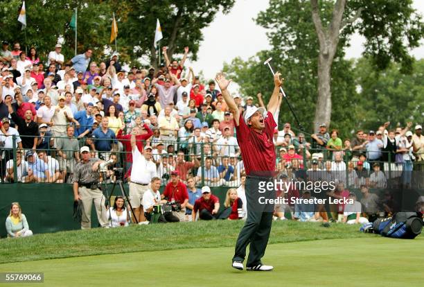 Team member Fred Couples reacts to making a putt on the 18th hole to win his match against International team member Vijay Singh 1 up during the...