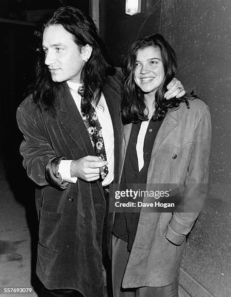 Singer Bono, of the band 'U2', and his wife Ali Hewson outside Langan's restaurant in London, February 1989.