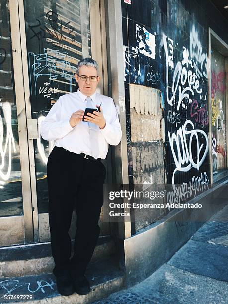 Man with a smartphone on the street, Valencia, Spain May 20, 2015