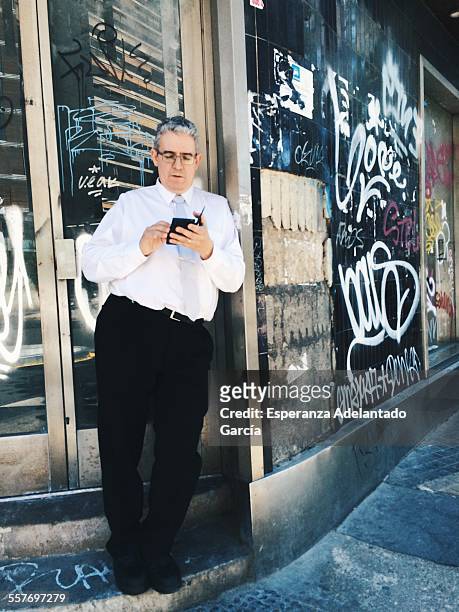 Man with a smartphone on the street, Valencia, Spain May 20, 2015