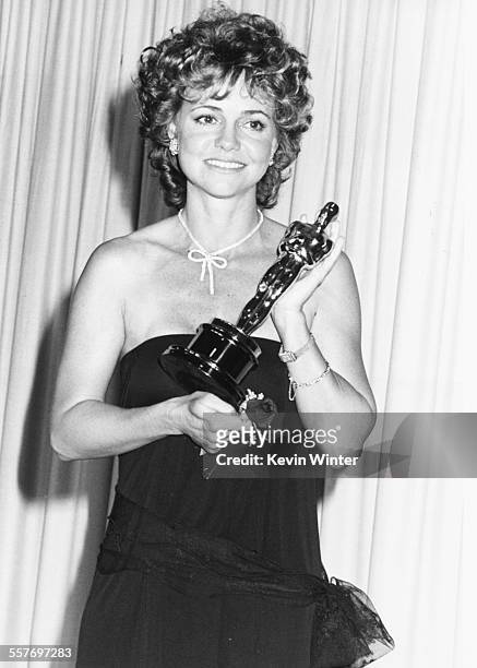 Actress Sally Field holding her 'Best Actress' Oscar for the film 'Places in the Heart', at the 57th Annual Academy Awards at the Shrine Auditorium...