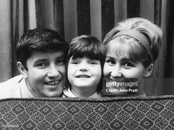 Portrait of British comedian Jimmy Tarbuck, with his daughter Mandy and wife Pauline, 1964.