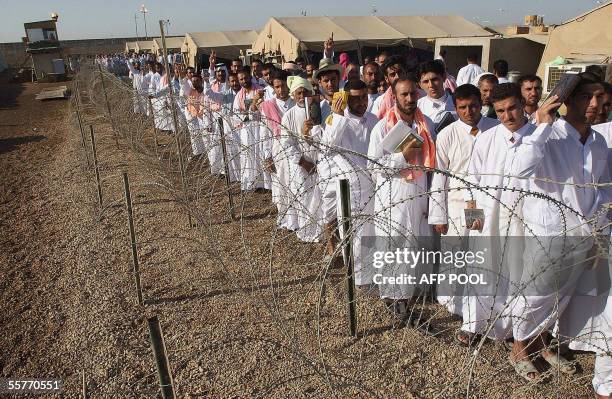 Iraqi Detainees stand in line waiting to be released from Abu Ghraib prison 26 September 2005 in Abu Ghraib, 30 kms west of Baghdad. The US military...