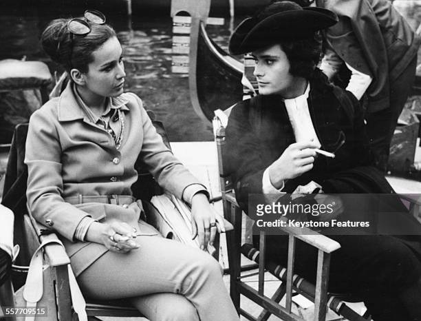 Actor Leonard Whiting in costume as 'Casanova', smoking a cigarette with a friend on the set of the film 'Giacomo Casanova: Childhood and...