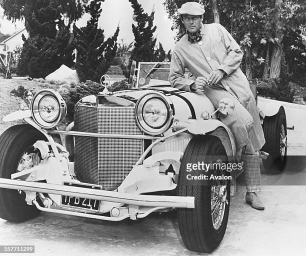 Portrait of 'Batman' actor Adam West with his replica 1929 Mercedes Benz SSK at his home, February 22nd 1967.