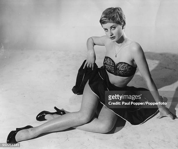 Portrait of English actress Jill Ireland wearing a bra and short skirt on August 19th 1955.