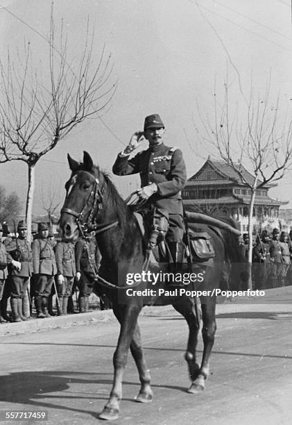 Imperial Japanese army General Iwane Matsui pictured on horseback, entering Nanking during the Second Sino-Japanese War, in December 1938.