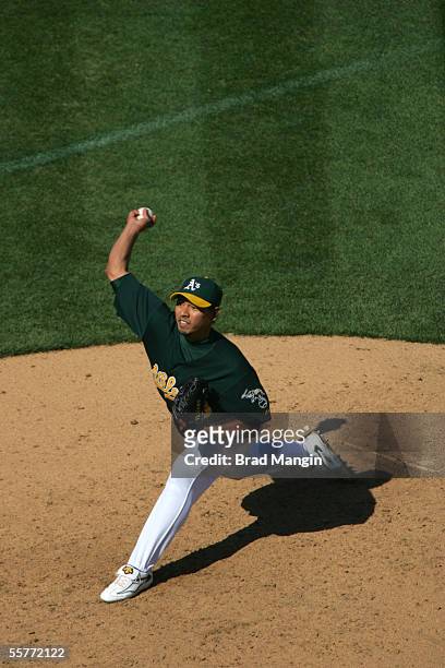Keiichi Yabu of the Oakland Athletics pitches during the game against the Minnestoa Twins at McAfee Coliseum on September 21, 2005 in Oakland,...