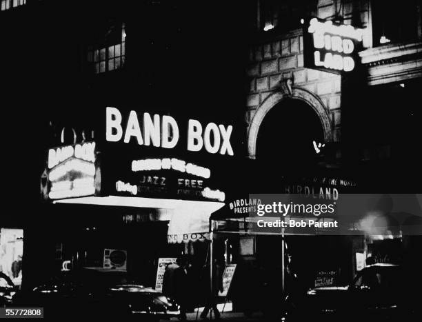 Night view of the exteriors of the Band Box and Birdland music clubs on 'Swing Street' , New York, New York, 1950s.