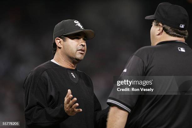 Manager Ozzie Guillen of the Chicago White Sox argues an unidentified umpire during the game against the Minnesota Twins at U.S. Cellular Field on...