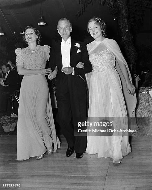 Actress Irene Henry with Actor Otto Kruger and his wife Sue MacManamy arrive to an event in Los Angeles, California.