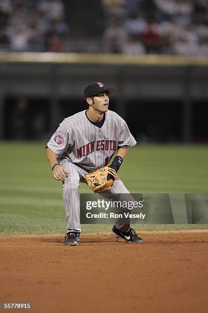 Jason Bartlett of the Minnesota Twins fields during the game against the Chicago White Sox at U.S. Cellular Field on August 17, 2005 in Chicago,...