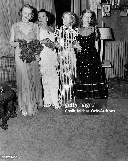 Actresses Virginia Bruce, Dolores del Rio, Anita Louise and Joan Bennett gather at a party in Los Angeles, California.