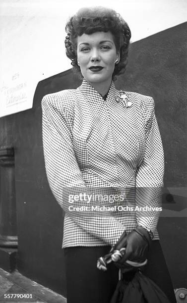 Actress Jane Wyman poses as she leaves the studio in Los Angeles, California.