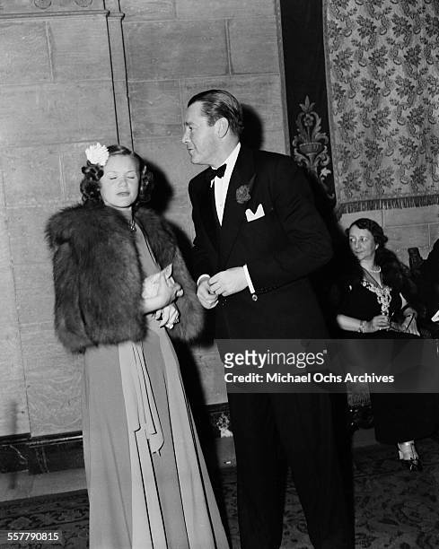 Actor Herbert Marshall and actress Simone Simon attend an event in Los Angeles, California.