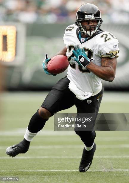 Fred Taylor of the Jacksonville Jaguars carries the ball during the game with the New York Jets on September 25, 2005 at Giants Stadium in East...