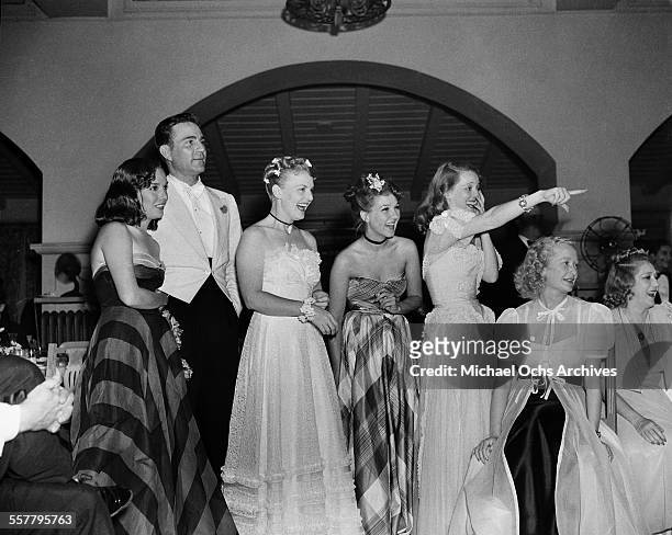 Actress Lupe Velez, actor Henry Wilcoxon, actress Jean Parker , actress Bette Davis, Miriam Hopkins and Mary Pickford attend a party in Los Angeles,...