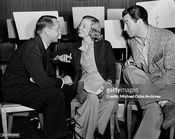 Actress Barbara Stanwyck and husband actor Robert Taylor with actor Franchot Tone on the set of 'Three Comrades' in Los Angeles, California.