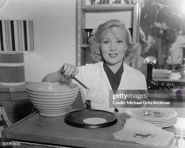 Actress Ann Sothern poses as she makes crepes in Los Angeles, California.