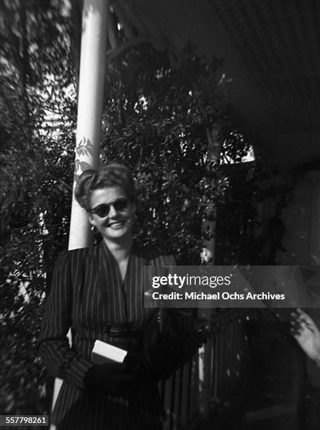 Actress Ann Sheridan poses on a street in Los Angeles, California.