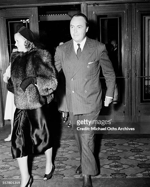 Actress Simone Simon with escort leaves a theater in Los Angeles, California.