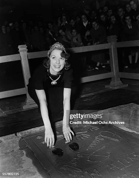 Actress Eleanor Powell has her hands added to cement in front of Grauman's Chinese Theatre in Los Angeles, California.