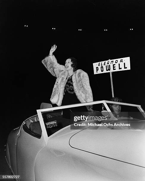 Actress Eleanor Powell waves to fans during the Hollywood Chirstmas Parade in Los Angeles, California.