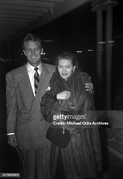 Actor Robert Stack arrives to an event with actress Yvonne De Carlo in Los Angeles, California.