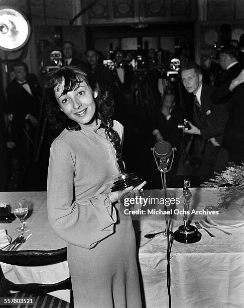 Actress Luise Rainer poses with her Oscar after winning The Academy Award for Best Actress for "The Good Earth" during the 10th Academy Awards at the...