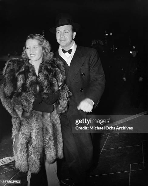 Actor Dick Powell with his wife actress Joan Blondell attend an event in Los Angeles, California.