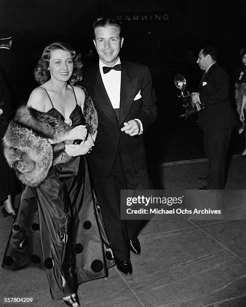 Actor Dick Powell with his wife actress Joan Blondell attend an event in Los Angeles, California.