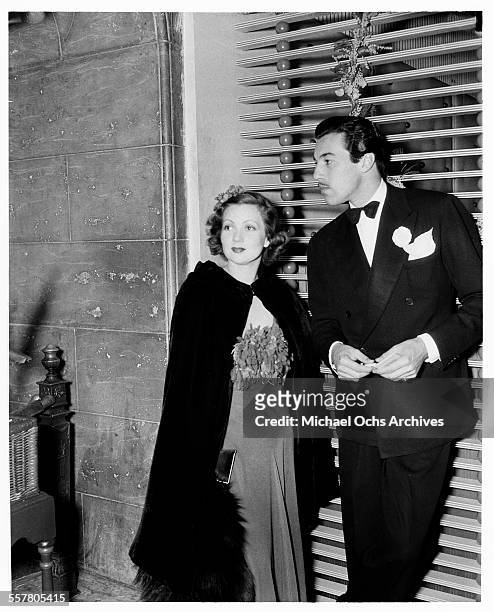 Actor Cesar Romero stands with actress Virginia Bruce in Los Angeles, California.
