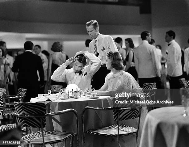 Actor Tyrone Power with actress Loretta Young gets ready for a scene during the making of 20th Century Fox movie "Second Honeymoon" in Los Angeles,...