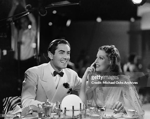 Actor Tyrone Power and actress Loretta Young get ready for their scene during the making of 20th Century Fox movie "Second Honeymoon" in Los Angeles,...