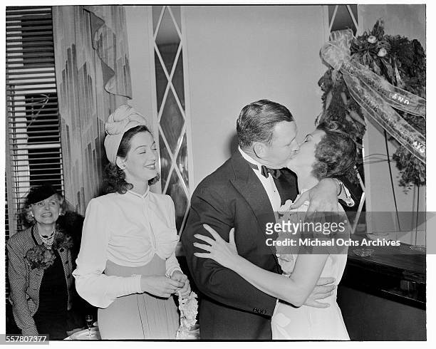Actress Rosalind Russell stand as a witness to a friends wedding in Los Angeles, California.