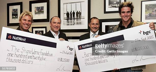 Cricket stars Shane Warne and Kevin Pietersen collect their donations of USD 125,000 from Lee Amaitis and Shaun Lynn, Chairman and President of BGC...