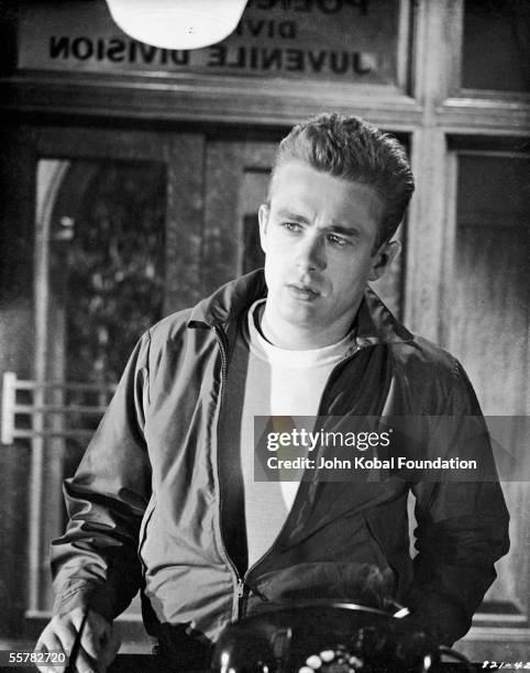 American actor James Dean enters the Juvenile Division of the police station in a scene from Nicholas Ray's film, 'Rebel Without a Cause', 1955.