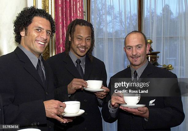 Doug Howlett and Tana Umaga, with All Black Masseur Lipi Sinnott enjoy a cup of tea at Buckingham Palace, where the team met Her Magesty Queen...