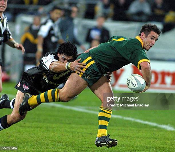 Andrew Johns from Australian Rugby league team looks to offload the ball to set up Australias first try in the match against the Kiwis at the...