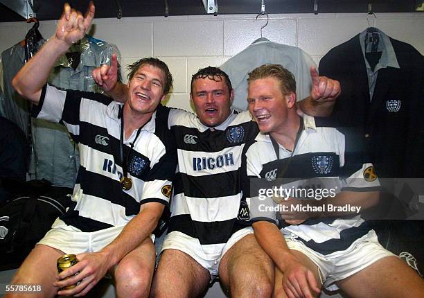 Auckland players Ali Williams, Scott Palmer and Daniel Braid celebrate in the dressing room after the NPC first division final clash between Waikato...