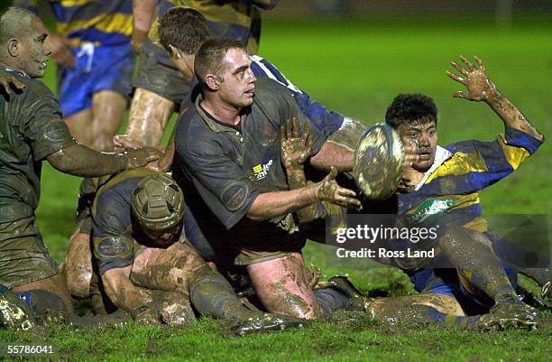 Bay of Plenty's wing Keith Pryor attempts to get out of the way as Nelson Bays No 8 Cory Holdaway clears from a ruck in the Air New Zealand NPC...