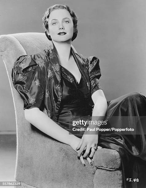 Studio portrait of Scottish actress Frieda Inescort pictured sitting in an armchair for Warner Bros and Vitaphone Pictures, circa 1940.