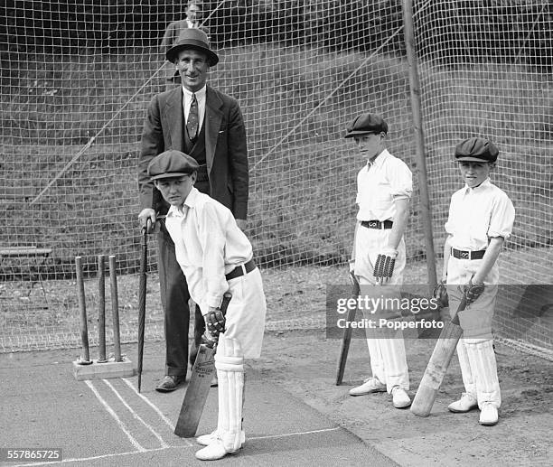 English cricket player and captain of the England cricket team, Douglas Jardine judging a boys cricket match at a garden party in Regent's Park,...