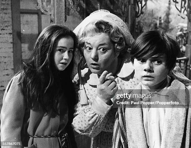 Actors Sally Ann Jones, Hattie Jacques and Jack Wild pictured together in a scene from the television show 'Knock Three Times', circa 1968.