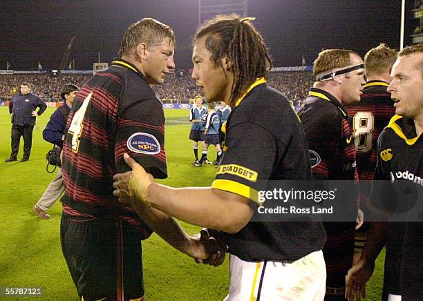 Canterbury lock Todd Blackadder shakes hands with All Black team mate Tana Umaga after the Air New Zealand NPC first division final won 3429 by...