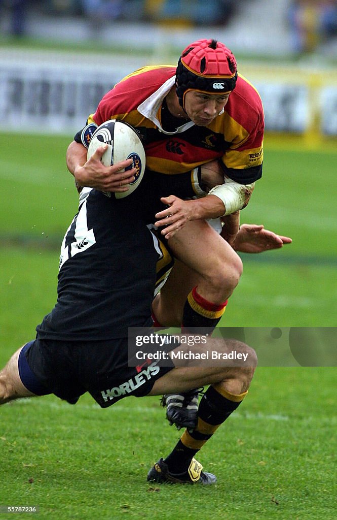 Bruce Reihana from Waikato is tackled by Dominic B