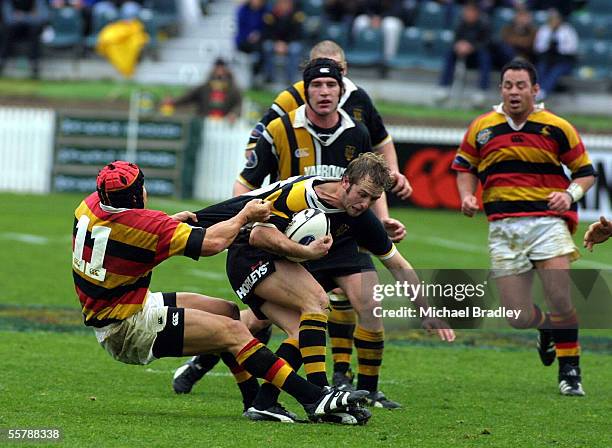 Daryl Lilley from Taranaki is tackled by Bruce Reihana from Waikato, during their rugby NPC match played in Hamilton at Wetspactrust park, Saturday....