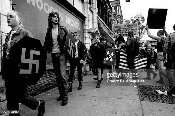 Neo-Nazis march across the street from Harry S Truman College during a counter protest at an anti-racist graffiti rally, Chicago, Illinois, 1976....